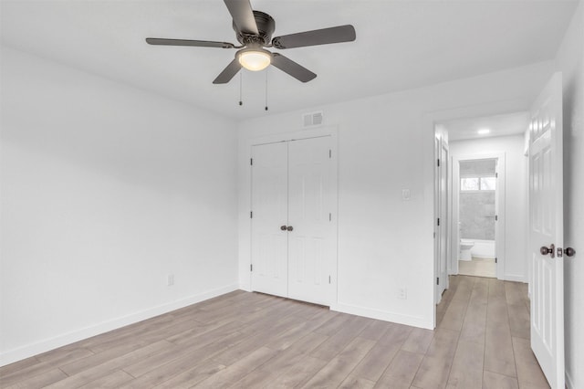 unfurnished bedroom featuring a closet, ceiling fan, and light hardwood / wood-style flooring