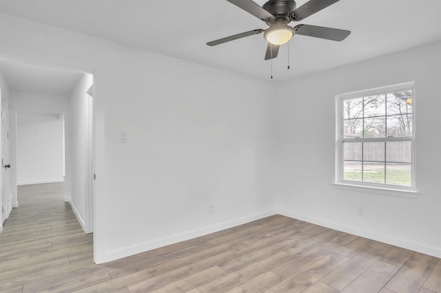 unfurnished room with ceiling fan and light hardwood / wood-style floors