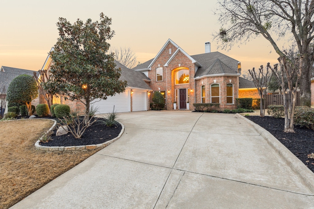 front facade with a garage