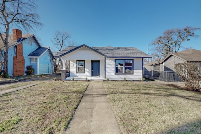 bungalow-style house with a porch and a front yard