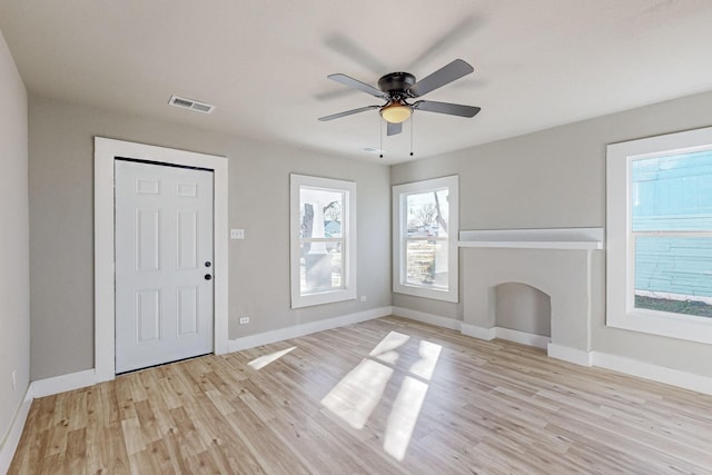 foyer featuring ceiling fan and light hardwood / wood-style floors