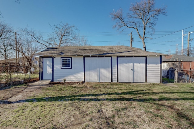 view of outbuilding with a yard