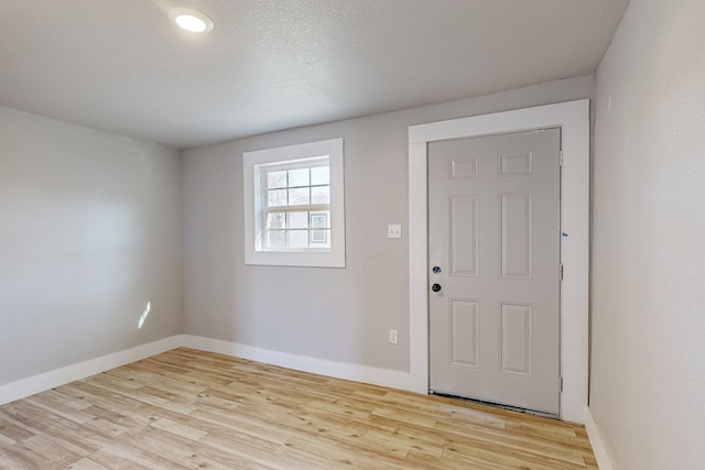 foyer entrance with light hardwood / wood-style flooring