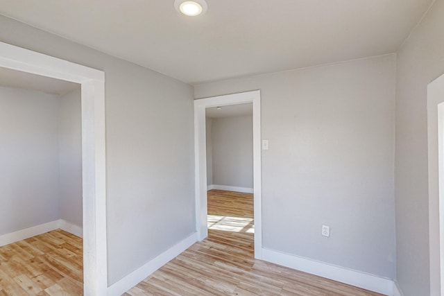 spare room with light wood-type flooring