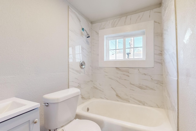 full bathroom with tiled shower / bath combo, vanity, and toilet