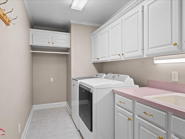 washroom featuring sink, crown molding, light tile patterned floors, independent washer and dryer, and cabinets