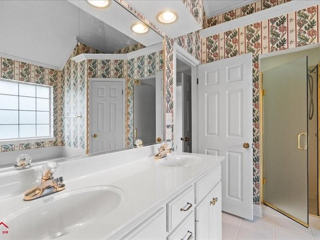 bathroom with vaulted ceiling, vanity, walk in shower, crown molding, and tile patterned floors