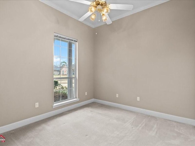 spare room with light carpet, crown molding, and ceiling fan