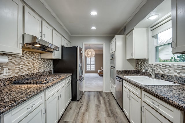 kitchen with white cabinetry, sink, and stainless steel appliances