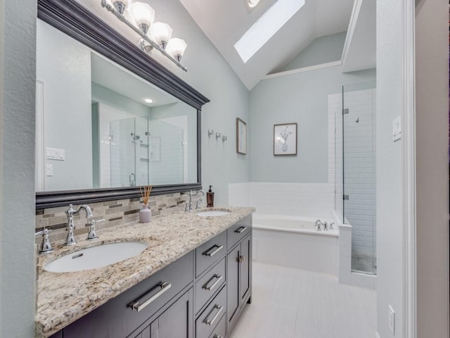 bathroom featuring lofted ceiling with skylight, separate shower and tub, vanity, tile patterned flooring, and decorative backsplash