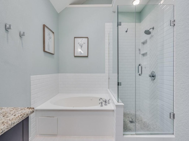 bathroom with vanity and plus walk in shower