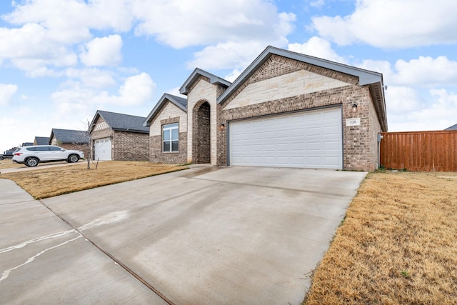 single story home featuring a garage and a front lawn