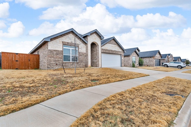 view of front of house with a garage and a front yard