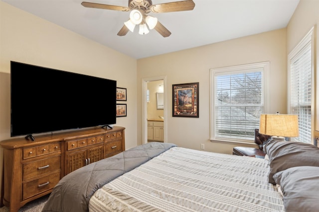 bedroom with connected bathroom and ceiling fan