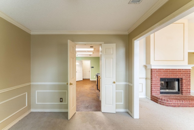 hall with light carpet, crown molding, and a textured ceiling