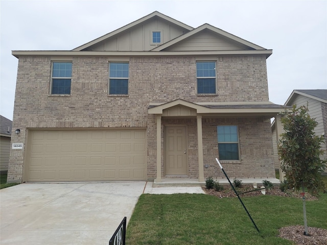 view of front of home with a garage and a front yard