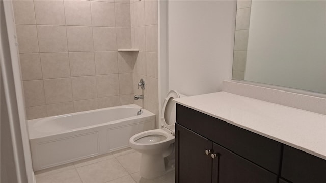 full bathroom with tile patterned flooring, vanity, toilet, and tiled shower / bath