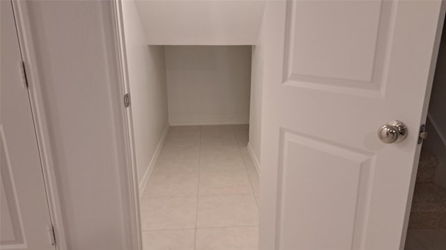 hallway with light tile patterned floors