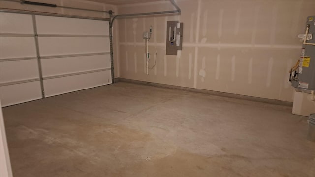 garage featuring electric panel and water heater