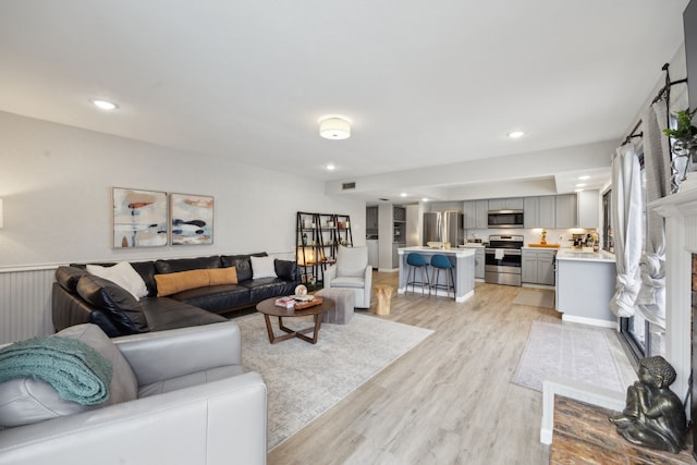 living room with light hardwood / wood-style floors