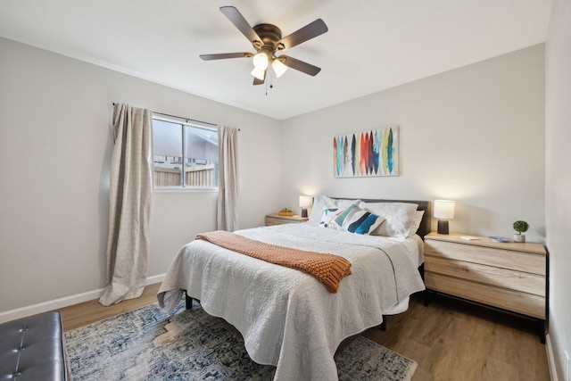 bedroom with hardwood / wood-style flooring and ceiling fan