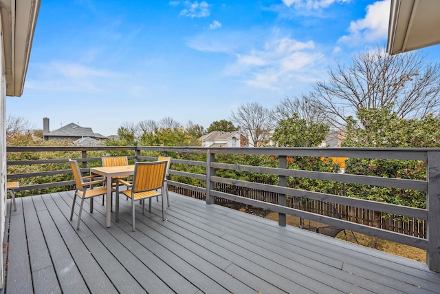 wooden terrace with outdoor dining space