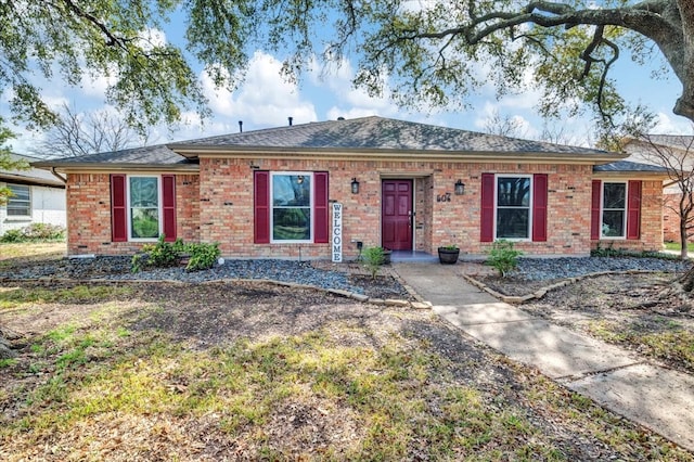 ranch-style house with brick siding and roof with shingles