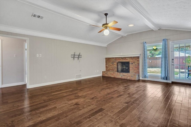 unfurnished living room featuring lofted ceiling with beams, ceiling fan, a brick fireplace, dark wood-type flooring, and a textured ceiling