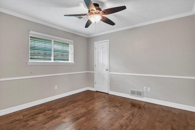 unfurnished room featuring ceiling fan, crown molding, and dark hardwood / wood-style flooring