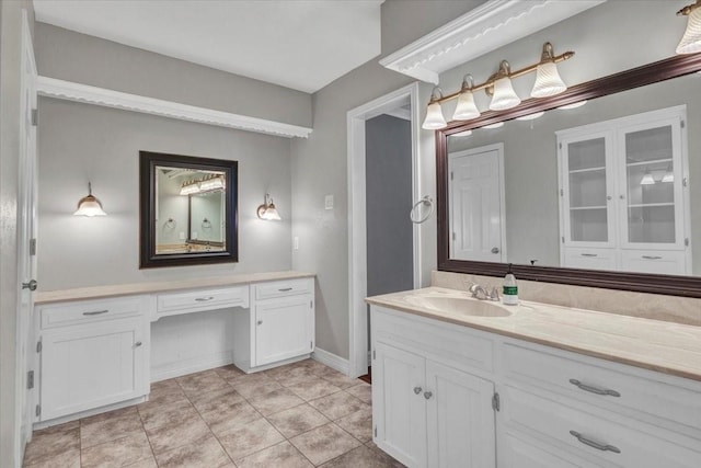 bathroom with tile patterned flooring and vanity