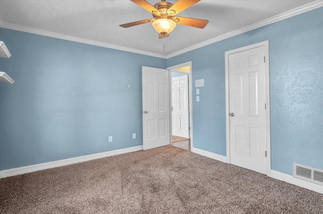 unfurnished room featuring crown molding, ceiling fan, and carpet floors