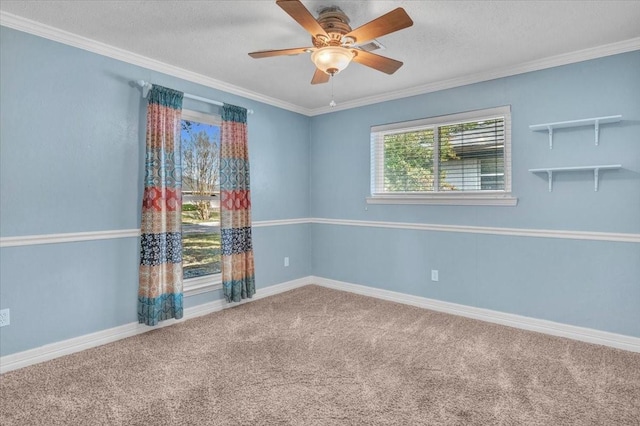 unfurnished room featuring ornamental molding, carpet, and a textured ceiling