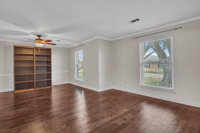 unfurnished room featuring ornamental molding, dark wood-type flooring, and ceiling fan