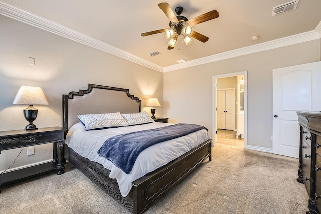 carpeted bedroom featuring ceiling fan, ornamental molding, and ensuite bath