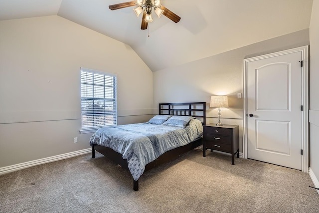 bedroom with ceiling fan, carpet floors, and vaulted ceiling