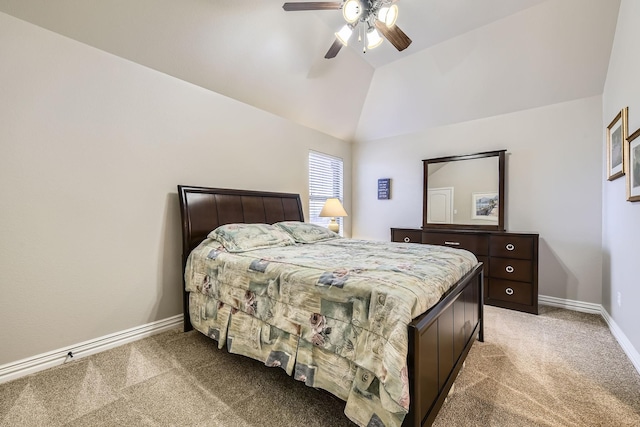 bedroom with vaulted ceiling, ceiling fan, and carpet floors