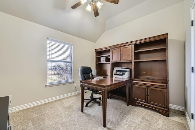 carpeted office space featuring lofted ceiling and ceiling fan