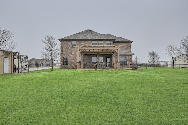 rear view of property featuring a pergola and a lawn