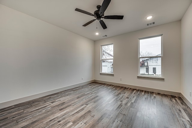 spare room featuring ceiling fan and hardwood / wood-style floors