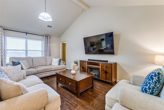 living room with dark hardwood / wood-style flooring, high vaulted ceiling, and beam ceiling