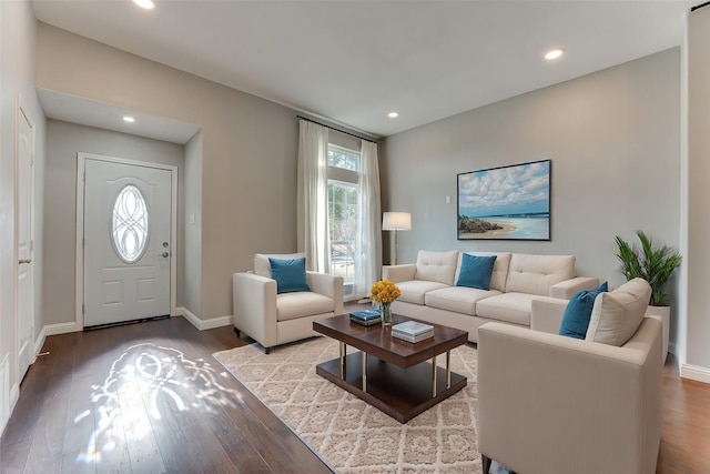living room featuring recessed lighting, wood finished floors, and baseboards