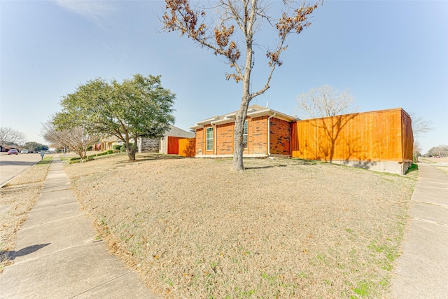 view of front of home featuring brick siding