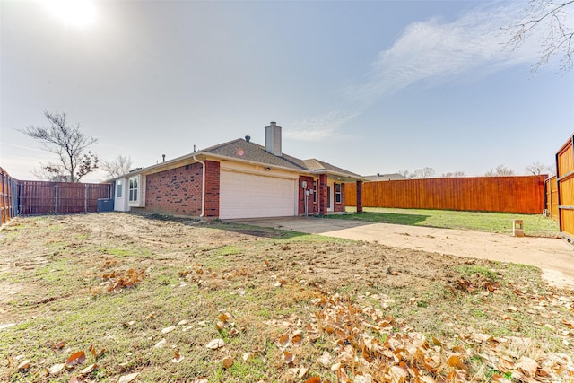 view of home's exterior featuring a garage and a lawn