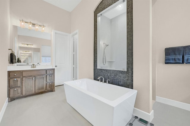 bathroom featuring vanity and a bath