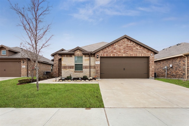 view of front of house with a front yard and a garage