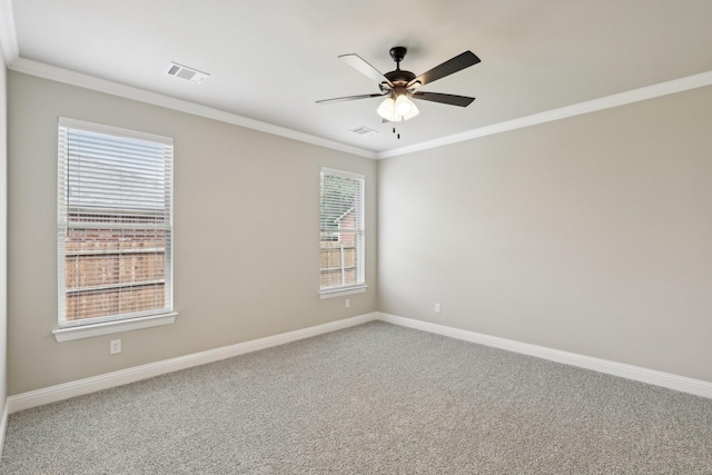 carpeted empty room featuring crown molding, a ceiling fan, and a wealth of natural light