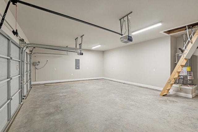 garage with baseboards, a garage door opener, and electric panel