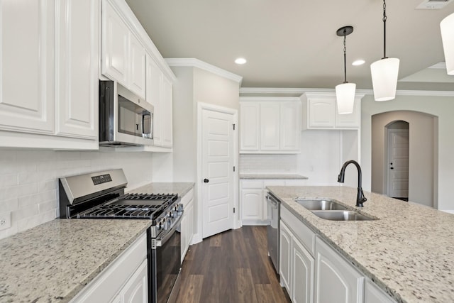 kitchen with a sink, white cabinetry, and stainless steel appliances