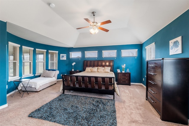 carpeted bedroom featuring ceiling fan and vaulted ceiling