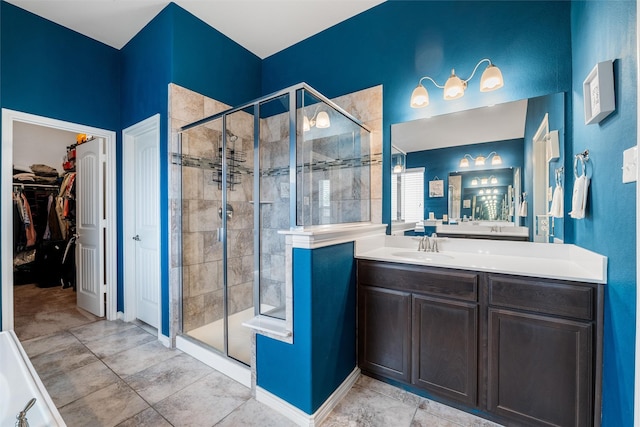 bathroom featuring tile patterned floors, vanity, and an enclosed shower